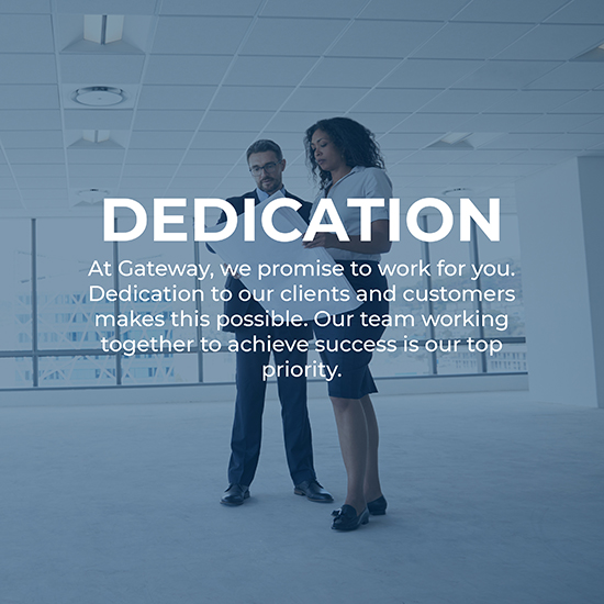 Businesspeople Meeting To Look At Plans In Empty Office